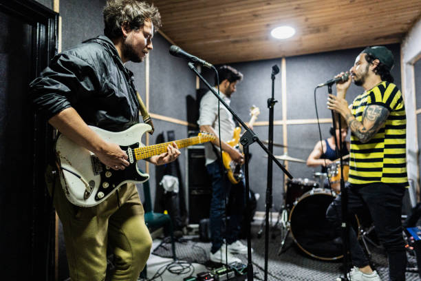 istock Rock band rehearsing in the recording studio 2151159918