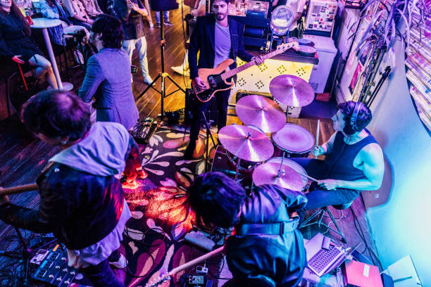 istock Mid adult man playing drum kit on a rock show 2151159971