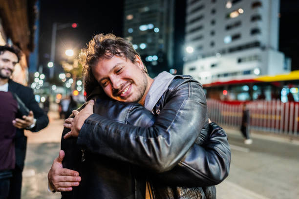 istock Friends embracing in the city 2151160027