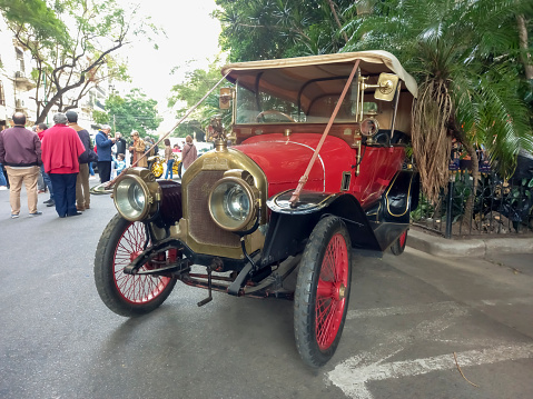 Buenos Aires, Argentina - May 13, 2023: Old red 1910s Peugeot phaeton in the street at an antique car show. Recoleta - Tigre Grand Prix.