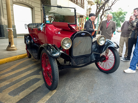 Buenos Aires, Argentina - May 13, 2023: Old red 1918 Chevrolet touring phaeton in the street at an antique car show. Recoleta - Tigre Grand Prix.