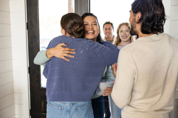 istock Multiracial group of friends greet one another 2151160417