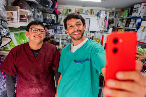 istock Veterinarian and assistant taking selfie in a pet shop 2151161442