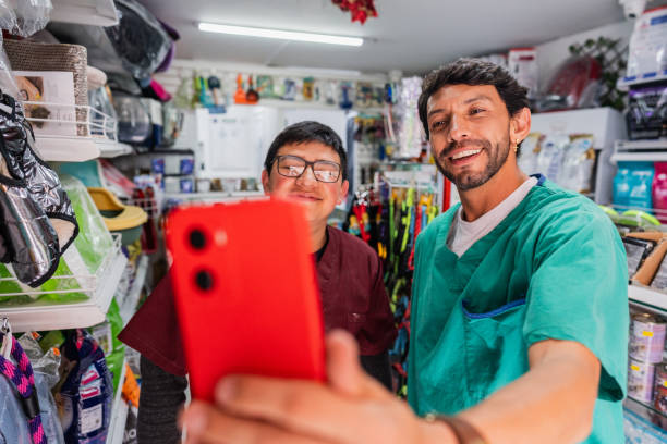 istock Veterinarian and assistant taking selfie in a pet shop 2151161443