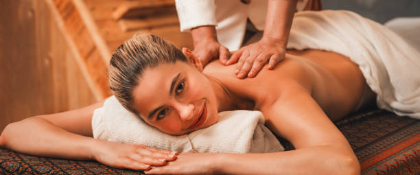 istock A pretty girl having a massage while looking at camera at sauna. Tranquility. 2151165024