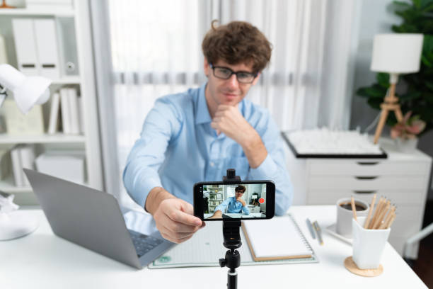 istock Influencer setting smartphone blurred image focusing face recording. Gusher. 2151167333