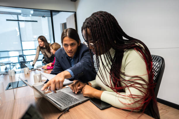 istock Coworkers working using laptop at the office 2151167510