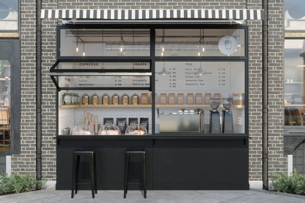 istock Front View Of Take-Away Coffee Shop With Black Stools 2151167678