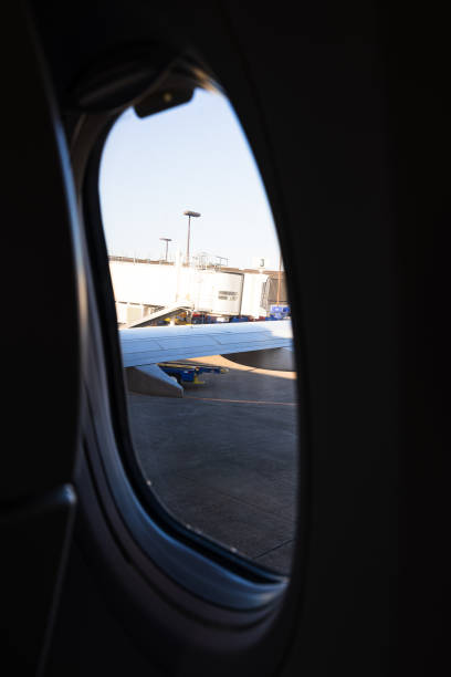 istock Looking out commecial airplane next to flight terminal 2151167915