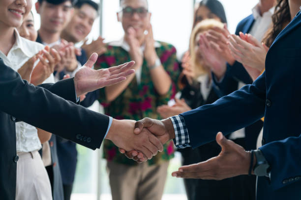 istock Cropped image of smart businessmen shaking hand, making agreement. Intellectual. 2151168542