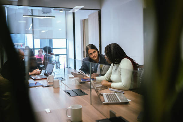 istock Coworkers working using laptop in the office 2151171841