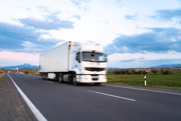 istock Cargo truck in motion on the road, cargo transportation concept 2151177669