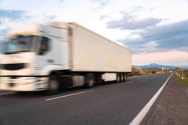 istock Cargo truck in motion on the road, cargo transportation concept 2151177699