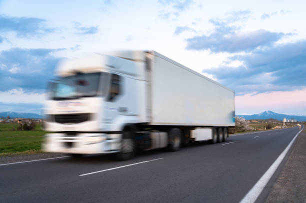 istock Cargo truck in motion on the road, cargo transportation concept 2151178376