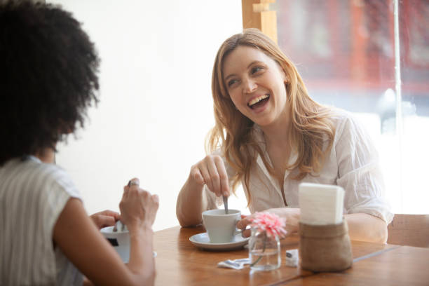 istock Women  talking and having fun in a cafe 2151178761