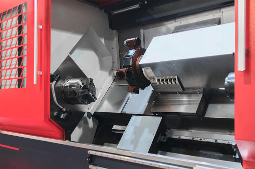 Manufacturing CNC professional lathe machine, Industrial concept.