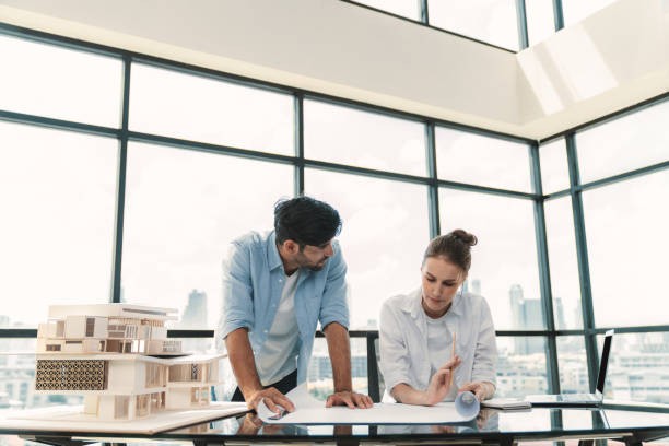 istock Professional architect team working together to design house model. Tracery. 2151183601