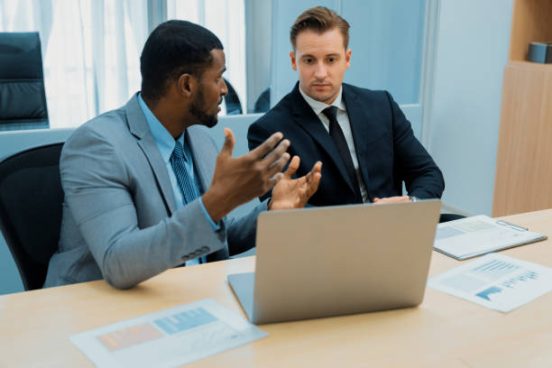 istock Cooperative handsome african businessman present start up project. Ornamented. 2151183651