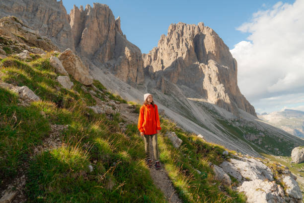 istock Determinted woman hiking in Dolomites mountains in summer 2151183834