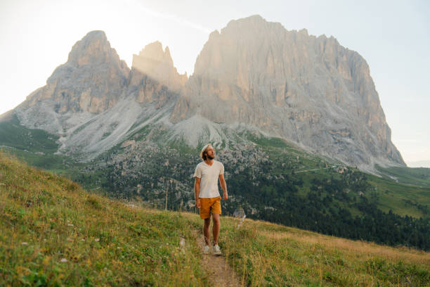 istock Man hiking in Dolomites mountains in summer 2151184480