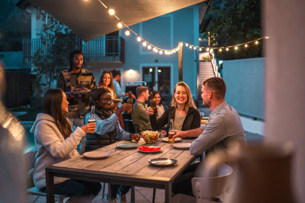 istock Multicultural Friends Enjoying Outdoor Dinner Party 2151185453