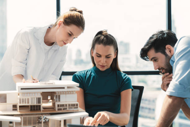 istock Skilled architect holding laptop while present idea to engineer team. Tracery. 2151185677