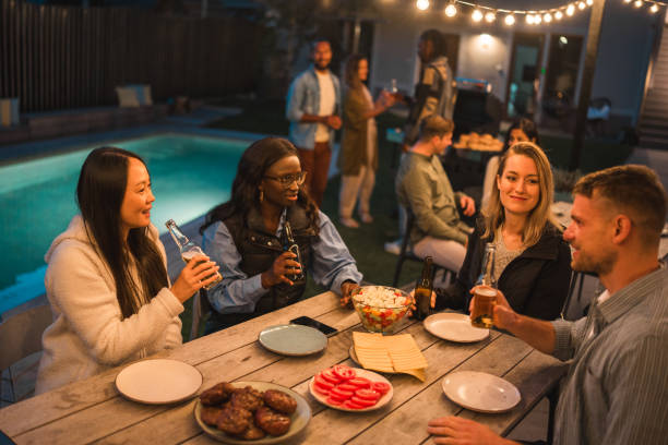 istock Diverse Friends Enjoying Outdoor Evening Party 2151185709