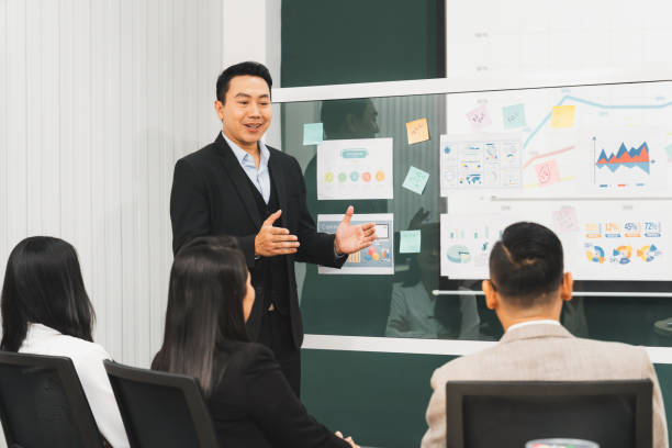 istock Confident manager presenting project in front of glass whiteboard. Intellectual. 2151186332