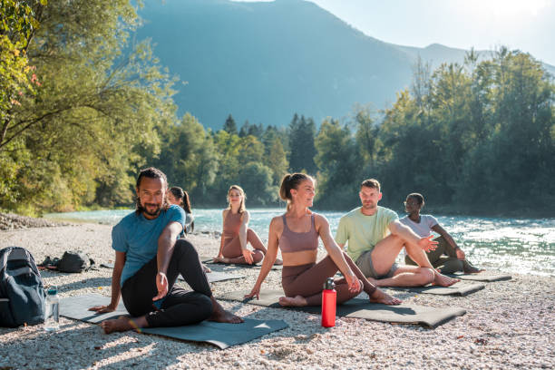 istock Peaceful Yoga Gathering by the Riverside 2151186346