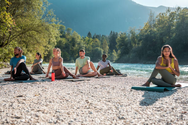 istock Diverse Group Yoga by the Riverside 2151186352