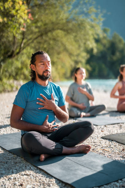 istock Peaceful Yoga Gathering by the Water 2151186364