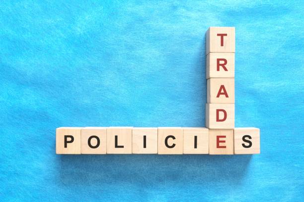 istock Crafting trade policy concept. Flat lay in blue background. 2151191990