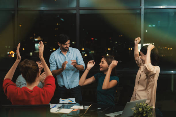 istock Businesspeople giving high five together while coworker clapping hands. Tracery. 2151193040