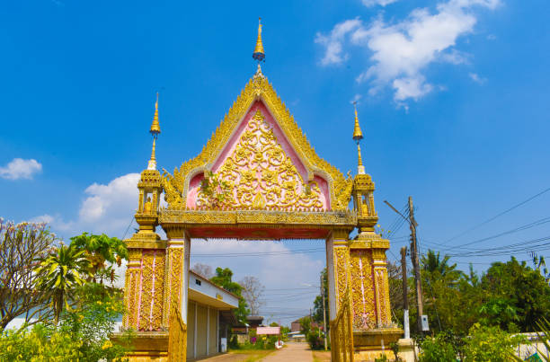 wat ton ha, gate, Phrae, Thailand, three gilded narrow hats, gilded buddha back, small gilded buddha relief, lots of wonderful gilded ornamentation, artwork, crafts, attraction, point of interest