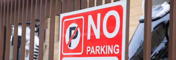 istock No Parking sign on fence 2151195747