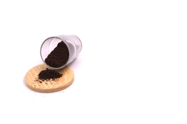 istock coffee grounds spilling from the glass 2151197843