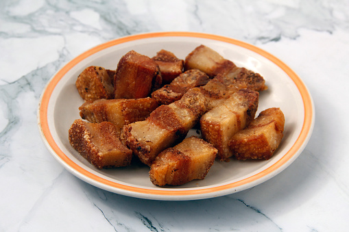 Photo of freshly cooked Filipino food called Lechon Kawali or deep fried and chopped pork belly.