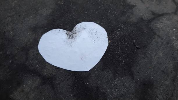 istock White love placed on the dirty floor 2151202969