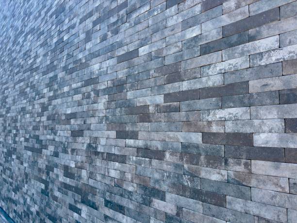 A sturdy, elegant stone block exterior wall, showcasing timeless durability and natural beauty, seamlessly blending into its surroundings with a classic yet contemporary charm.