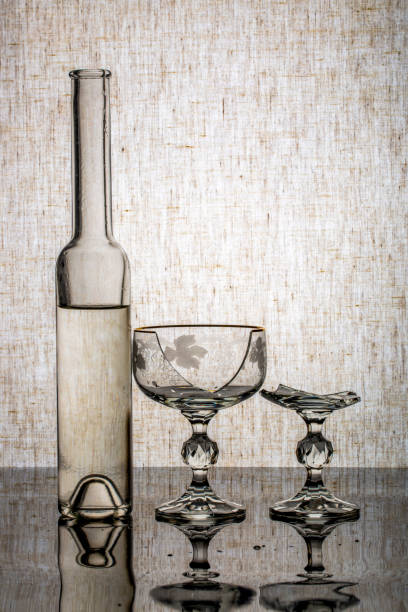 Still life with glassware and a broken glass