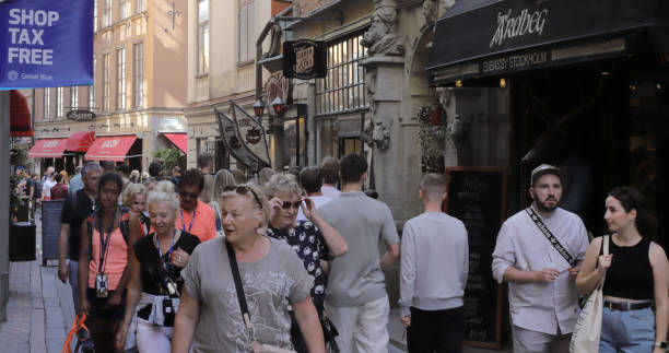 Stockholm, Sweden - July 14, 2023: The Vasterlanggatan street in Old town district crowded with people.