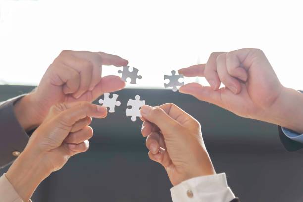 istock Businessman team work jigsaw. Business Concept. 2151207412