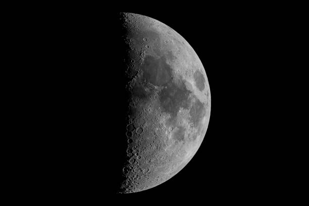 istock First quarter moon seen with an astronomical telescope (seen through my own telescope, no NASA images used) 2151209766