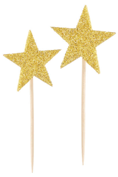 istock Golden Star Sticks Over White Background 2151213872