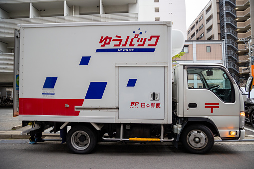 Fukuoka, Japan - April 19, 2023 : Japan Post delivery truck in Fukuoka, Kyushu, Japan.