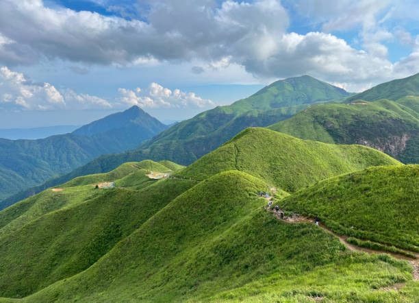 istock Green Mountain Scenery with Cloudy Summer Weather 2151218364