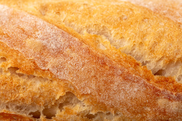istock Ruddy crust of bread as an abstract background. Texture 2151219516
