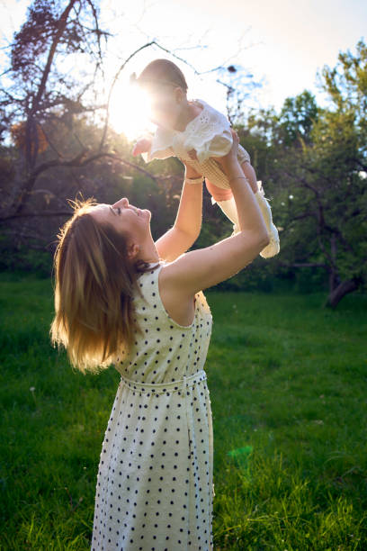 istock a mother holds her baby in her arms 2151224249