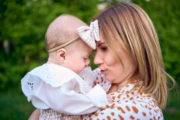 istock mothers with their tiny baby on a picnic 2151224468