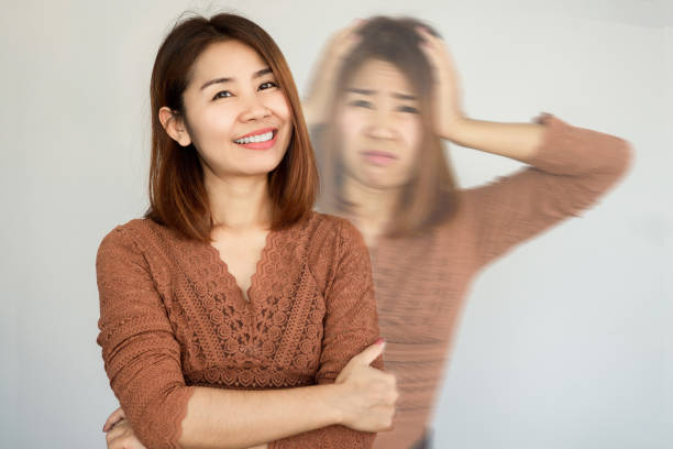 bipolar and smiling depression Asian woman in difference mood , double personality with positive and negative emotional